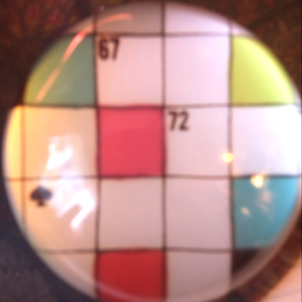 Kate Spade Crossword Puzzle glass paper weight. Signed on bottom.